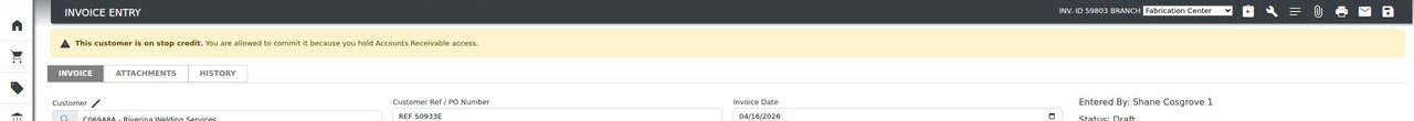The same invoice seen by a user with Accounts Receivable admin rights: an amber banner explains that the customer is on stop credit but they are allowed to commit.